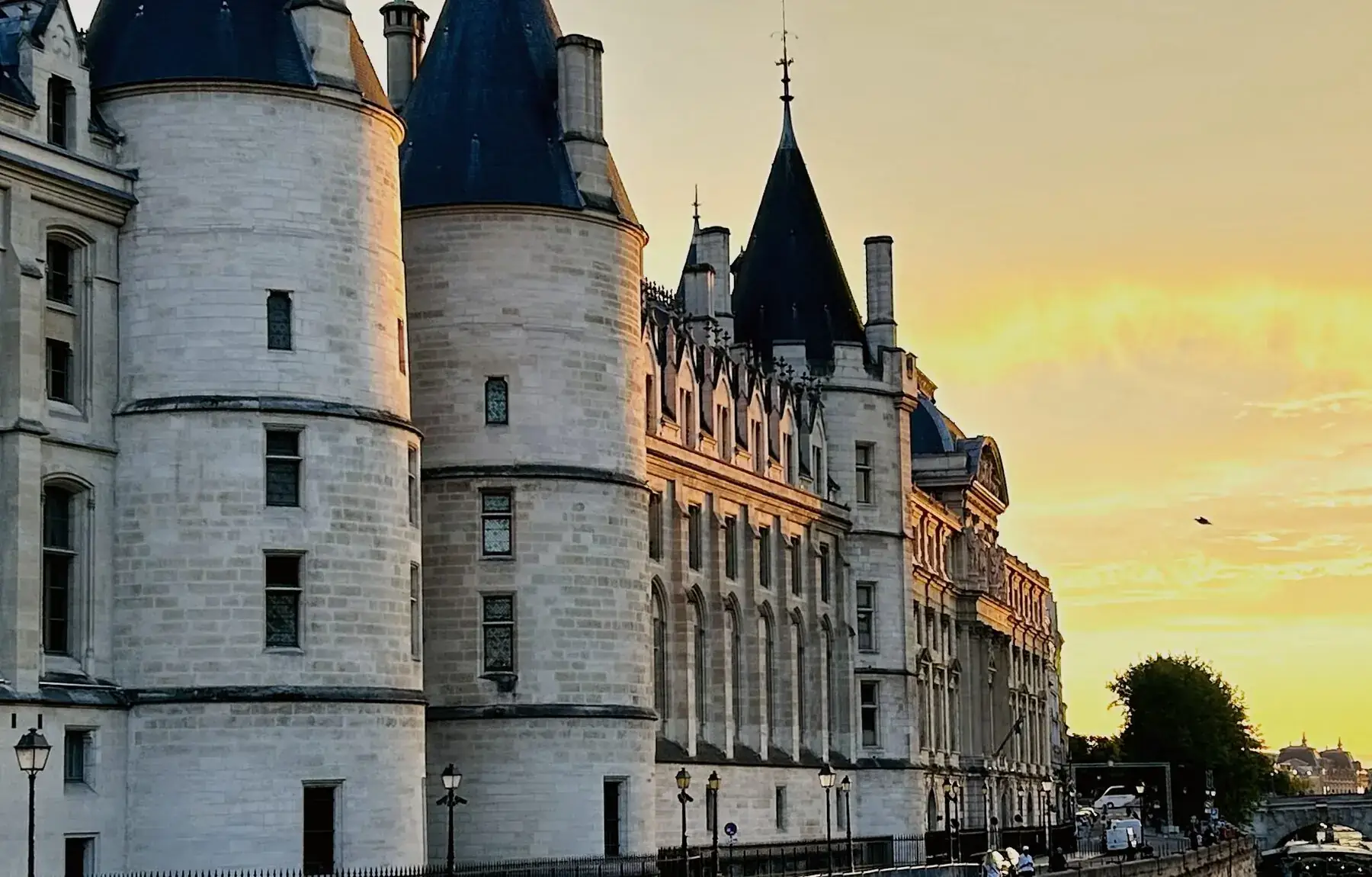 The towers of the Conciergerie on the Seine at sunset